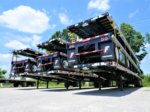 Flatbed trailers stacked on top of each other