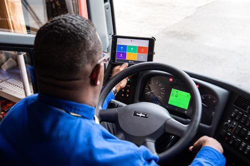 Truck driver reviewing Samsara Driver Efficiency Report
